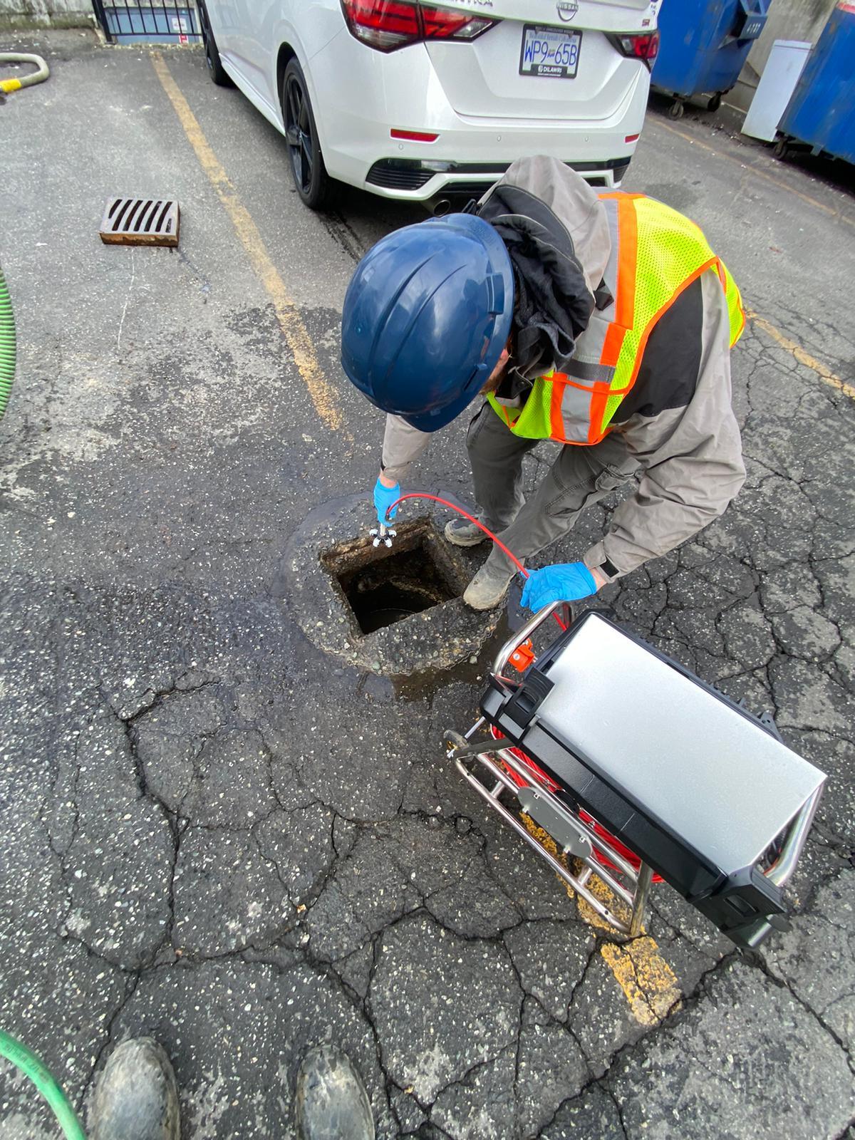 Clearset Vac Truck Services employee performing a line scope as part of hydro jetting service