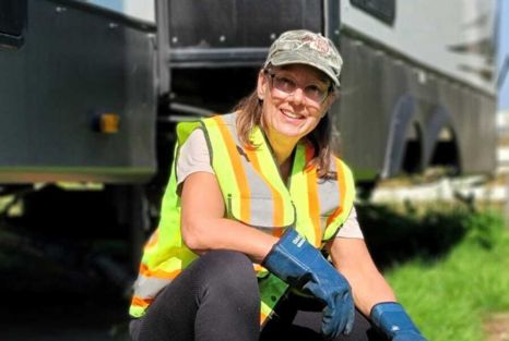 Clearset VAC Truck employee crouching in front of an RC they're pumping